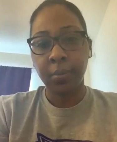 Selfie of a woman with glasses in a room.